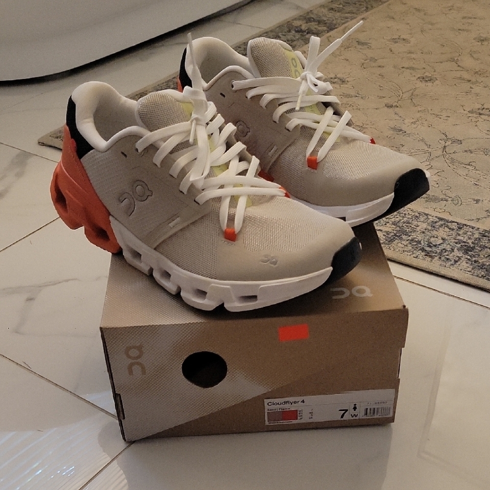 On Running Cream and Orange Athletic Shoes for Performance